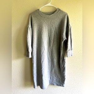 Kick it with some sneakers and relax in this sweatshirt dress WITH POCKETS!